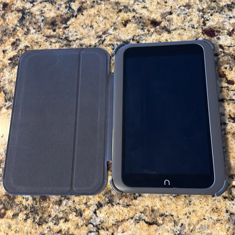 Nook reader with green case and charger cord